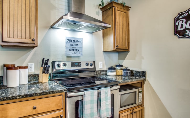 the collective at lubbock off campus cottage apartments kitchen stainless steel appliances