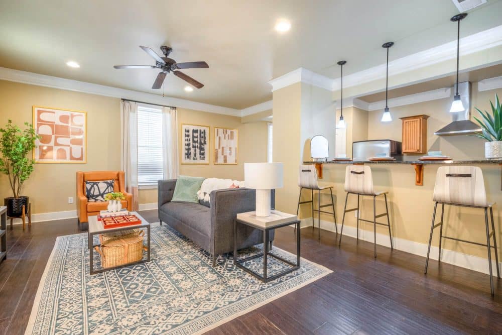 the collective at lubbock off campus cottage apartments floor plan cottage apartments fully furnished living room and full kitchen with bar stool seating