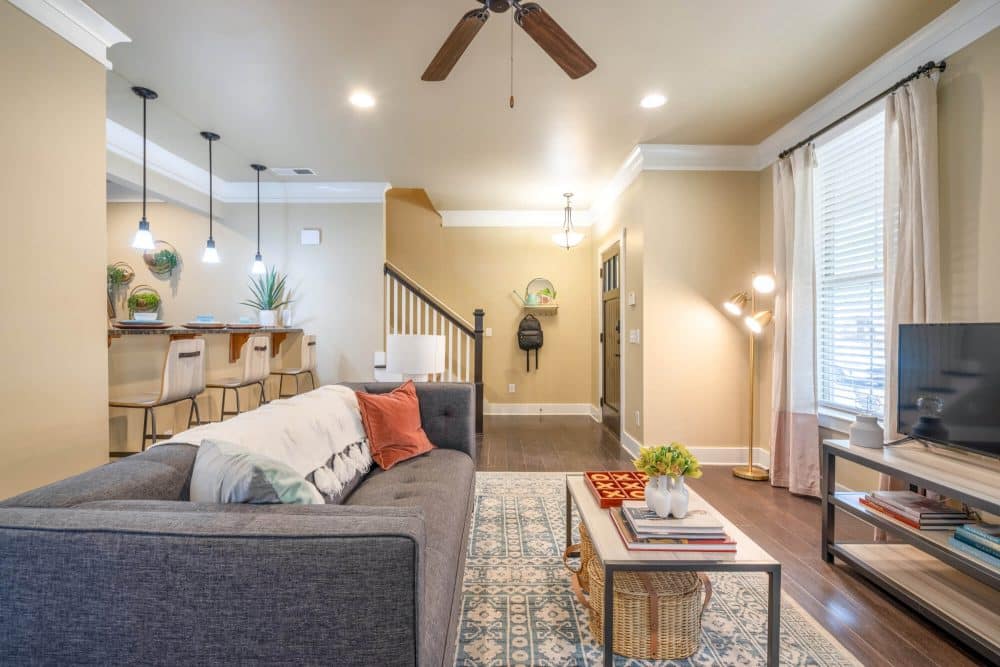 the collective at lubbock off campus cottage apartments near texas tech ttu 2 story cottage floor plan spacious layout fully furnished living room to kitchen