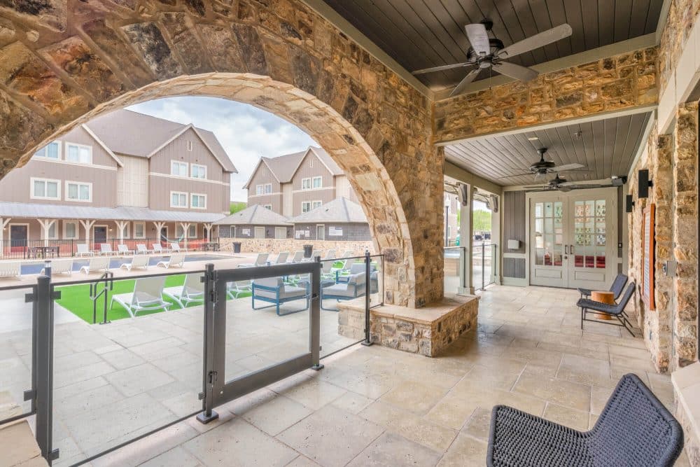 the collective at lubbock off campus cottage apartments near texas tech ttu resident clubhouse entrance to pool and outdoor gaming area